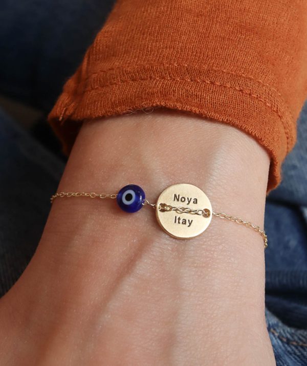 button bracelet blue eye / yellow gold plating